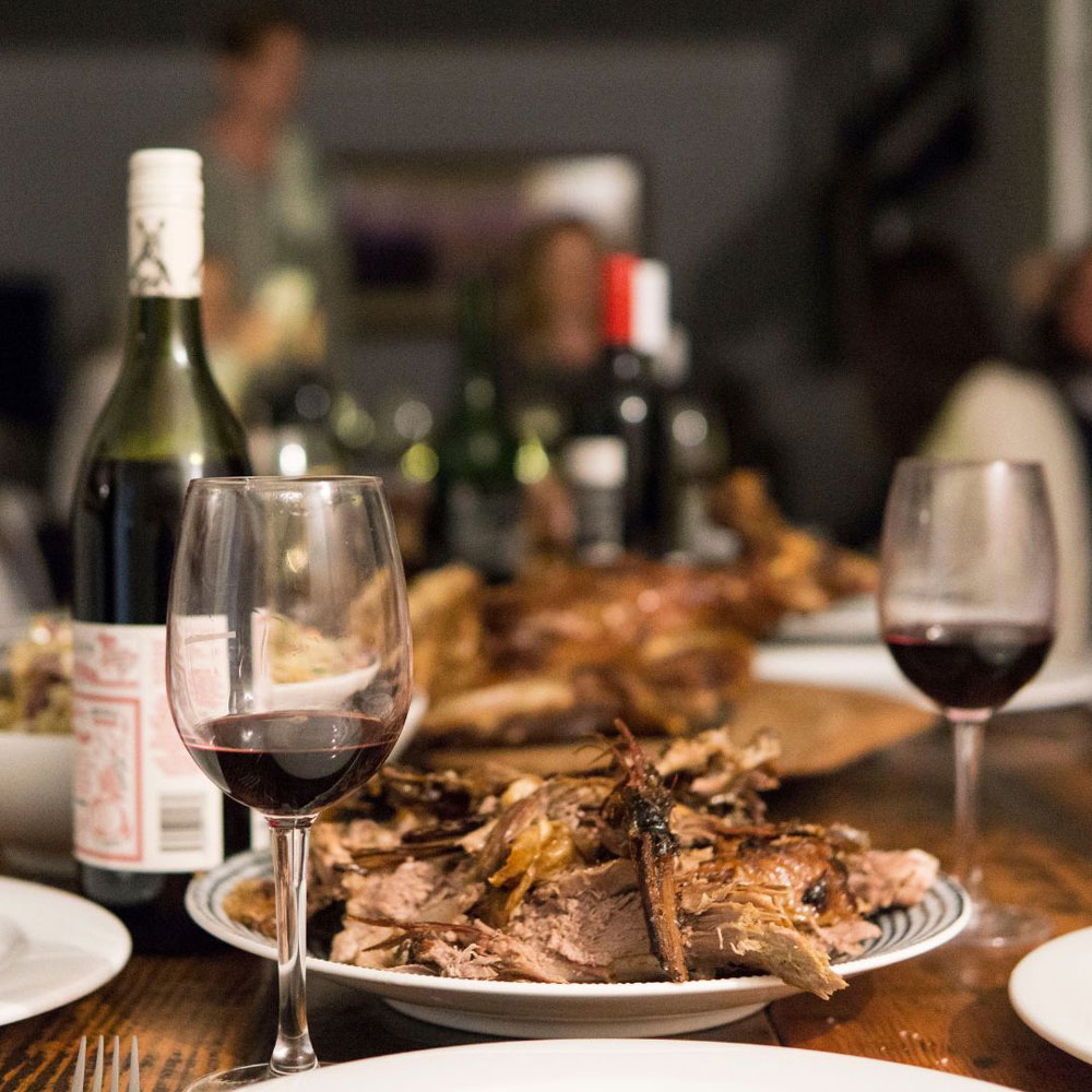 Roasted lamb on a serving dish on the dining table