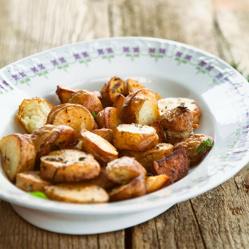 Roasted Potatoes with rosemary in serving bowl